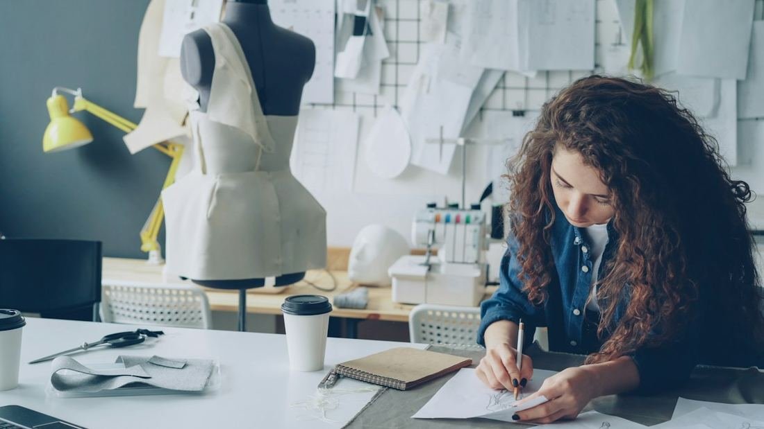 A pattern being drafted at the studio table